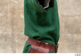  Photos Medieval Servant in suit 4 Green gambeson Medieval clothing bag grey red and hood leather belt medieval servant upper body 0004.jpg